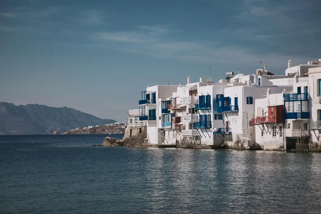 White Cycladic buildings in Mykonos — Aegean island day trips and cruise connections